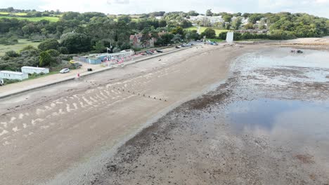 Pull-back-drone-aerial-reverse-reveal-beach-Bembridge-village-Isle-of-wight-Uk-drone,aerial