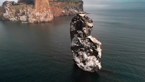 Drone-footage-of-a-single-cliff-that-rises-from-the-ocean-in-north-Iceland