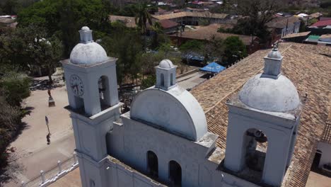 Descending-aerial-tilt-of-catholic-church-bell-towers-in-Honduras