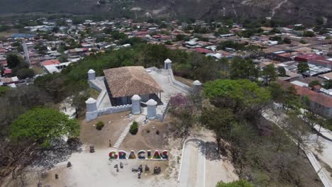 Aerial-orbits-old-San-Cristobal-fort-on-hilltop-in-Gracias,-Honduras