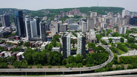 Aerial-view-tilting-toward-condos-in-the-Quartier-Concordia,-in-Montreal,-Canada