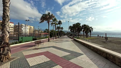 A-walk-along-the-coastal-path-in-Malaga,-Andalusia,-Spain,-in-slow-motion
