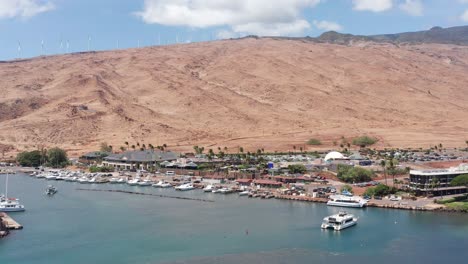 Low-aerial-shot-flying-over-Maalaea-Harbor-towards-the-Maui-Ocean-Center-in-West-Maui,-Hawai'i