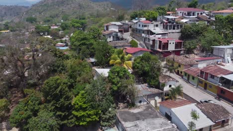 Low-flight-over-quaint-streets-and-home-rooftops-of-Copan-in-Honduras