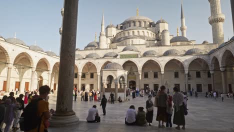 People-gather-in-the-Blue-mosque-courtyard-to-visit-tourist-attraction