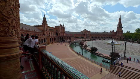 Slow-motion-panoramic-view-of-Plaza-de-España-in-Seville,-Spain,-captures-the-beauty-and-grandeur-of-this-iconic-landmark