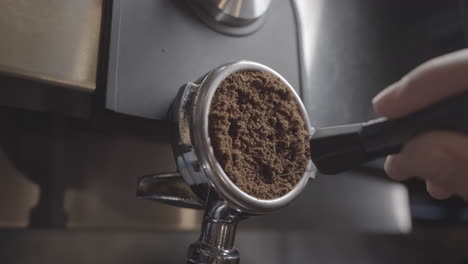 A-Reveal-Shot-Of-Ground-Coffee-Being-Stirred-With-A-Needle-Tamper-In-A-Portafilter