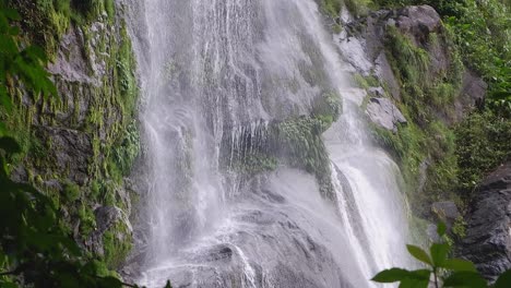 Cascade-el-Bejuco-waterfall-on-mossy-rock-cliff-in-Honduras-jungle