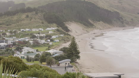 Tilt-shot-over-rural-New-Zealand-coast-line-at-Castle-Point-Beach,-Wairarapa