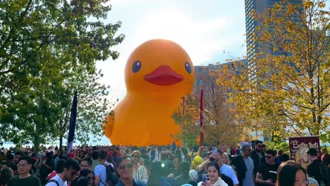 Swarm-of-people-visiting-worlds-largest-giant-rubber-duck-in-Toronto-Queens-Quay