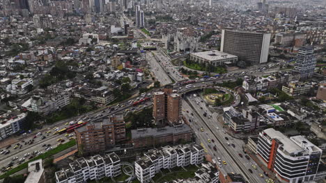 Bogota-Colombia-Aerial-v42-birds-eye-view,-flyover-La-Soledad-capturing-busy-traffics-on-Avenida-NQS-highway-intersection,-and-Teusaquillo-downtown-cityscape---Shot-with-Mavic-3-Cine---November-2022