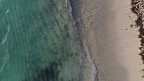 Cenital-Drone-View:-Pristine-Beach-and-Crystal-Blue-Waters,-a-Serene-Coastal-Scene