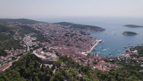 Aerial-croatia:-Tvrđava-Fortica-overlooking-Hvar's-harbor-and-Adriatic-Sea