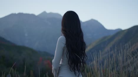 Young-Beautiful-Woman-Looks-at-Nature-and-Mountain-Views