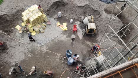 Workers-pour-concrete-at-the-construction-site-of-a-new-residential-building-in-the-city-center