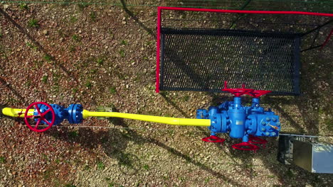 Valves-and-pipeline-of-natural-gas,-aerial-top-down-view