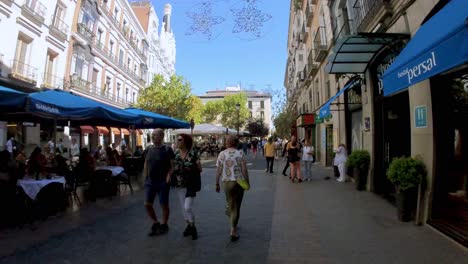 Spain,-Wander-down-Gran-Via,-Madrid's-lively-boulevard,-through-the-lens-of-our-gimbal-shot,-and-discover-the-city's-endless-charm