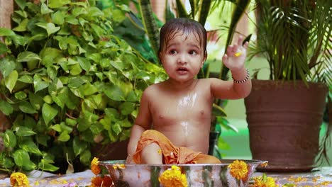 cute-toddler-baby-boy-bathing-in-decorated-bathtub-at-outdoor-from-unique-perspective
