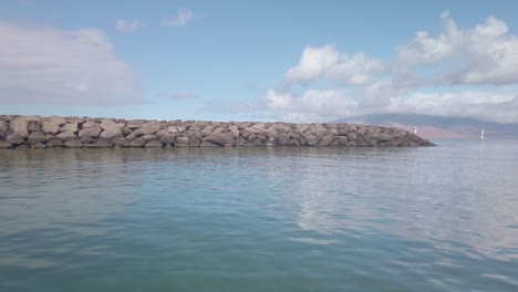 Gimbal-POV-shot-from-a-moving-boat-leaving-the-Kihei-Boat-Landing-in-South-Maui,-Hawai'i
