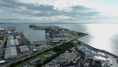 Aarhus-container-terminal-and-port-for-Molslinjen-ferry-company---Sunrise-aerial-showing-harbor-area-in-Aarhus-Denmark