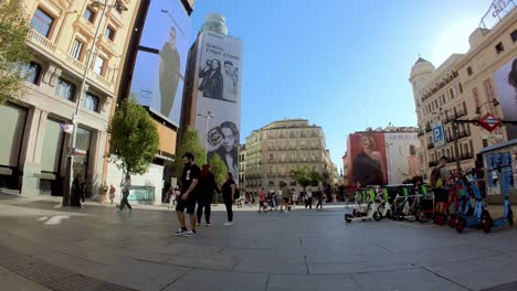 With-a-gimbal-shot-down-Gran-Via,-you-can-savor-the-atmosphere-of-Madrid's-most-famous-avenue,-right-from-your-screen