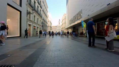 Wander-down-Gran-Via,-Madrid's-lively-boulevard,-through-the-lens-of-our-gimbal-shot,-and-discover-the-city's-endless-charm