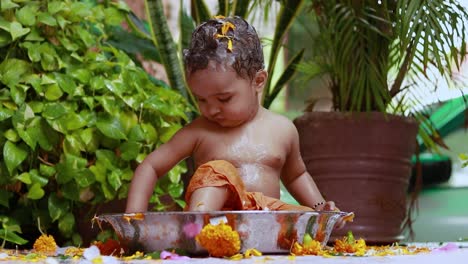 cute-toddler-baby-boy-bathing-with-shampoo-in-decorated-bathtub-at-outdoor-from-unique-perspective