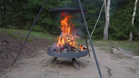 campfire-grill-or-Fire-pit-grill-with-burning-bright-wood-in-the-firebox