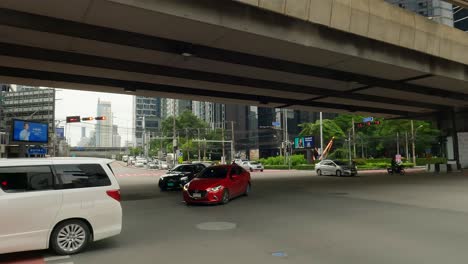 Vehicles-Crossing-The-Rama-9-Intersection-In-Bangkok-Thailand's-Downtown-Business-District