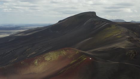 Cinematic-backwards-shot-of-Raudaskal-Crater-in-volcanic-scenery-of-Iceland-during-cloudy-day