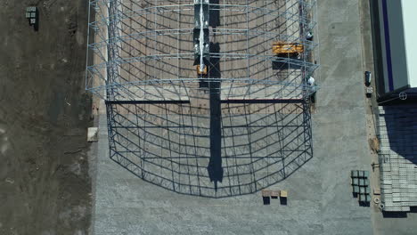 Grain-warehouse-frame-made-of-steel-for-construction,-aerial-drone-view