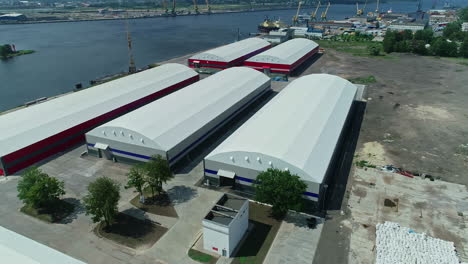 Multiple-warehouses-situated-near-a-dockyard-near-sea