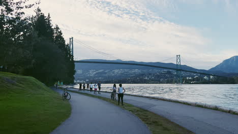 Cycling-through-Stanley-Park-in-Vancouver-,-moving-shot