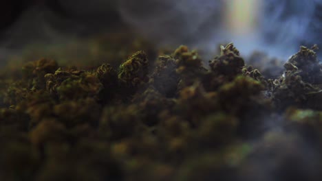 A-bunch-of-cbd-and-thc-marijuana-buds-recorded-from-up-close-as-the-smoke-drifts-by