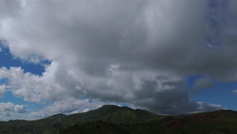 Aerial-clips-of-dense-clouds-hovering-over-a-hilly-region