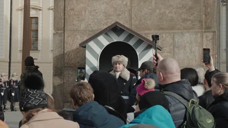 Tourists-watch-as-one-guard-replaces-another-at-Prague-Castle's-Guard-Box