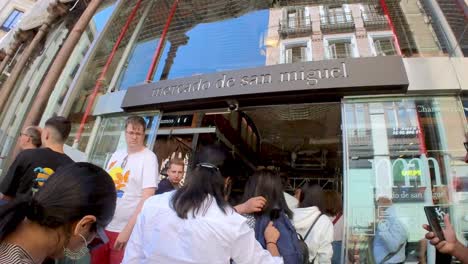 Join-us-on-a-culinary-adventure-through-Mercado-de-San-Miguel-in-Madrid,-where-our-gimbal-shot-invites-you-to-savor-the-flavors-of-tapas,-cheese,-olives,-and-delectable-jamón