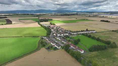 4K-Stationary-Aerial-of-Scottish-Country-Town-just-outside-of-Edinburgh,-The-Capital-of-Scotland,-United-Kingdom