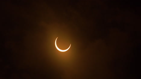 Timelapse-of-an-annular-solar-eclipse-entering-totality-with-clouds,-October-14th,-2023