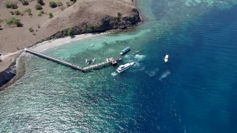 Komodo-aerial-of-the-beach-and-reef-on-a-hot-sunny-day
