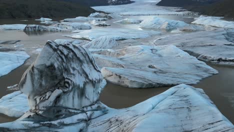 Aerial-view-of-the-largest-ice-cap-in-Europe,-Svinafellsjokull-Glacier-Lagoon,-Melting-iceberg,-Iceland