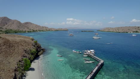 Komodo-aerial-of-the-beach-and-reef-on-a-hot-sunny-day