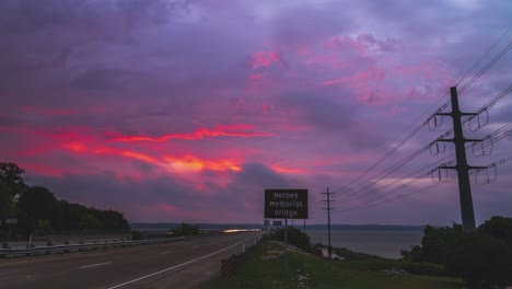Heroes-Memorial-Bridge-time-lapse-of-epic-fire-red-glow-on-clouds-at-blue-hour