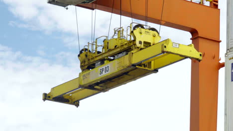 panning-shot-of-a-container-gantry-crane-on-a-cargo-rail