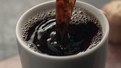 Coffee-is-poured-into-a-mug