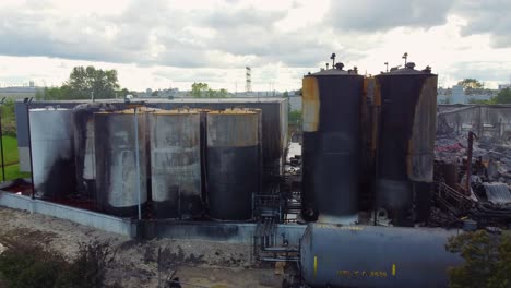 Burnt-Chemical-Tanks-And-Rubbles,-Aftermath-of-Catastrophic-Industrial-Fire-In-Canada