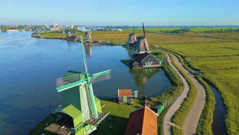 Aerial-drone-footage-of-still-windmills-in-Zaanse-Schans,-Netherlands---a-breathtaking-aerial-tourist-attraction-located-near-Amsterdam