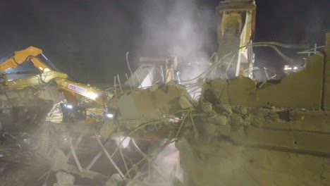 Demolition-Machines-Working-At-Night,-Breaking-Sunnidale-Road-Bridge-Over-Highway-400-In-Barrie,-Canada