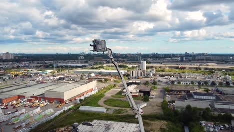 aerial-survey-of-modern-firefighting-apparatus,-robotic-hose-aiming-attachment-at-the-end-of-a-firetruck-boom