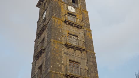 Pan-up-across-historic-brick-tower-of-Iglesia-de-la-Concepcion-in-San-Cristobal,-Spain